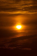 Golden Sunset Sky with Sun and Clouds