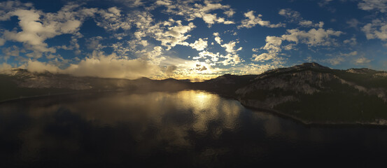 Dramatic Aerial Panorama of Clouds and Mountain Landscape. Nature Background.