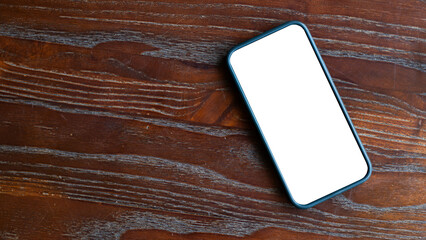 Smart phone with white screen Placed on a wooden background, top view