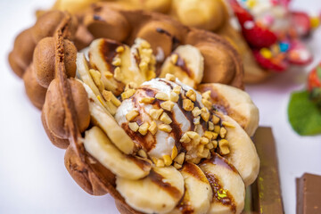 Hong Kong waffle with ice cream, topping, berries and sweets