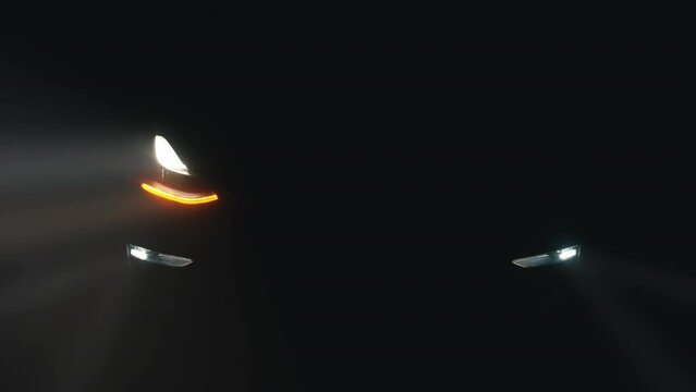 Car flasher with flashing indicator. Close-up of the turned on LED lights of an anonymous prestigious luxury modern car. Car turn signal, car light flashes constantly.