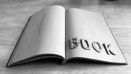 Notebook, diary, paper, pencil, brown, black and white on the table.