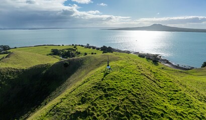 The volcano and crater of Browns Island in the Waitamata Harbour. In the background is Rangitoto...