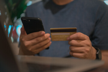 Man holding credit card and smartphone for online shopping, digital payment concept. cellphone app check balance client banking customer transaction