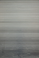 Fototapeta premium Rolled Steel Shutter Door Texture Background . Vertical shot