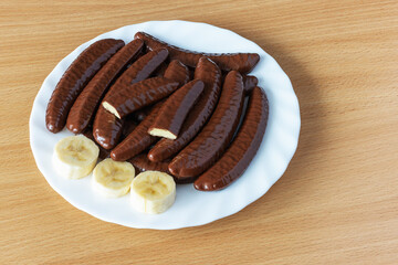 Chocolate covered banana flavored slices on a plate