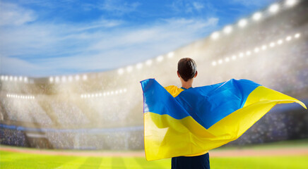 Ukraine football team supporter on stadium.