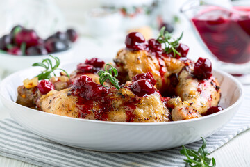 Chicken legs with cherry sauce and rosemary.