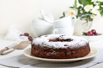 Chocolate pie with cherries.