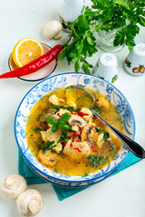 Spicy chicken soup with mushrooms.