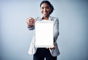 Happy woman, portrait and tablet with mockup screen for advertising or marketing on a gray studio...