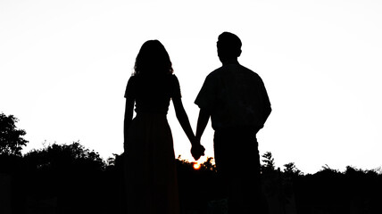 The scene depicts a silhouette of a loving couple.