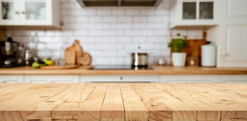 Wood table top on blur kitchen counter with window (room)background.For montage product display or design key visual layout.