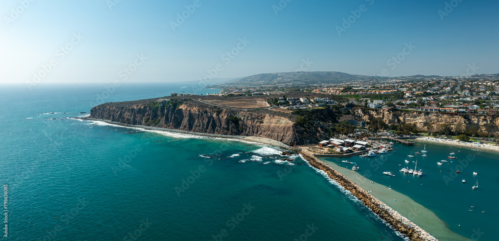 Wall mural aerial panoramic view of dana point harbor and jetty, california coastline