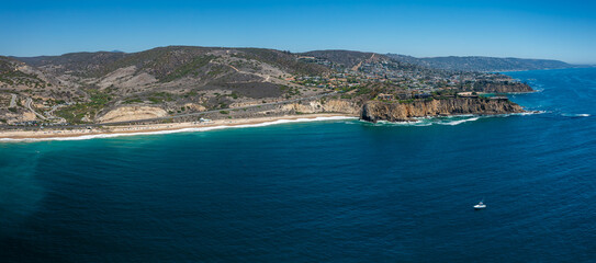 Naklejka premium Aerial View of Newport Beach, California with Cliffs and Blue Sea