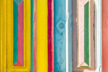 Old wooden door with shabby colorful paint close up. Traditional architecture in Porto, Portugal.