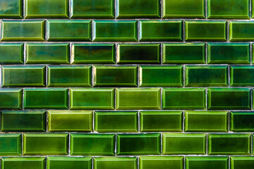 Green glazed tile on the facade of the house in Lisbon, Portugal. Abstract background