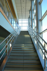 Long staircase with railings in a modern building