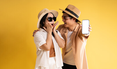 Portrait image of couple posing on yellow background, summer, travel