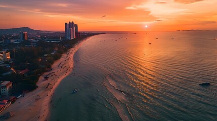 Stunning Aerial Panorama of Pattaya Beach at Captivating Sunset with Glowing Orange Hues over - obrazy, fototapety, plakaty