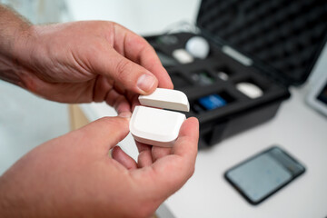 A technician works with a demo kit of the smart home system