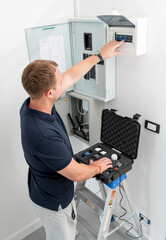 A technician works with a demo kit of the smart home system