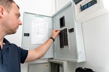 A technician works with a demo kit of the smart home system