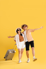 Portrait image of couple posing on yellow background, summer, travel © Q88