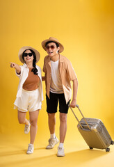 Portrait image of couple posing on yellow background, summer, travel