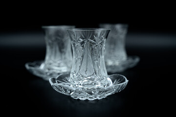 crystal tea glass on black background
