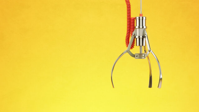 Machine  claw on yellow background. Crane game.
