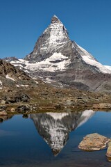 Fototapeta na wymiar Reflection of the Matterhorn Mountain in a lake, Swiss Alps