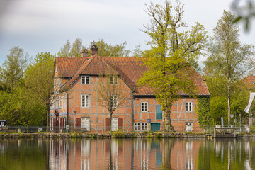Obraz premium View across the mill pond to the historic watermill
