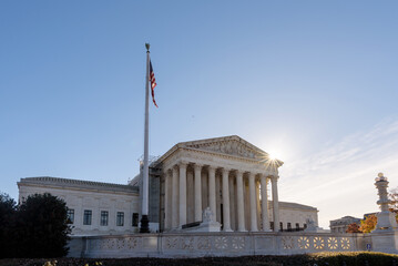 U.S. Supreme Court Building with Blue Sky with the sun, Washington DC, USA