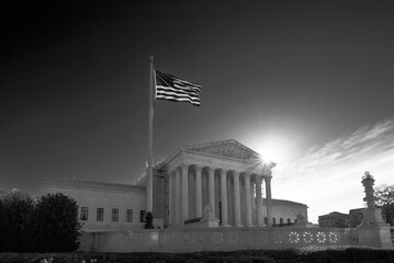 U.S. Supreme Court Building with Blue Sky with the sun in black and white, Washington DC, USA