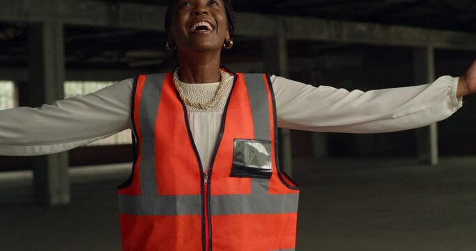 Smiling Black Woman Engineer at Construction Site, Dancing and Spinning