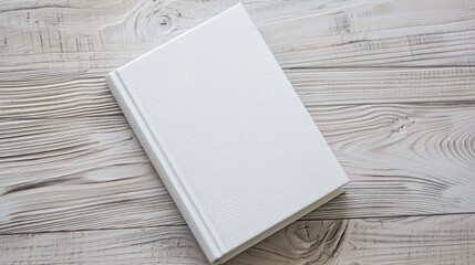 white diary mockup on pale woodgrain table surface