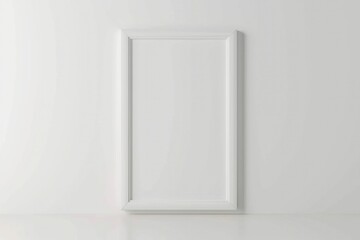 White Art Frame. Vertical Blank Picture Frame on Isolated White Wall