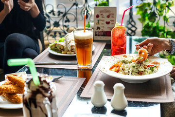 Table With Assorted Food and Drinks for Diverse Dining Experience