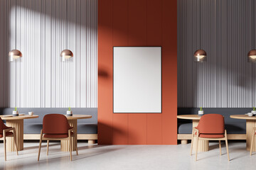 Interior of a modern cafe with blank poster, wooden furniture, and orange accent wall under soft light. 3D Rendering