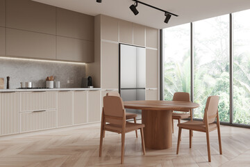 Naklejka na ściany i meble Modern kitchen interior with wooden furniture and large windows overlooking greenery, minimalist style on a bright day. 3D Rendering