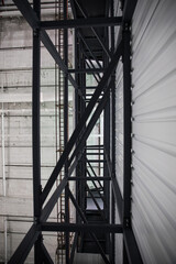 Industrial Shelves: Symmetrical view of empty industrial warehouse shelving