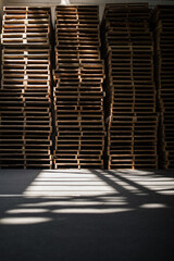 Stacked Pallets - Neatly organized wooden pallets in a warehouse
