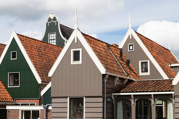 Typical wooden houses with gables along the river in the Dutch picturesque village of De Rijp in the Beemster.