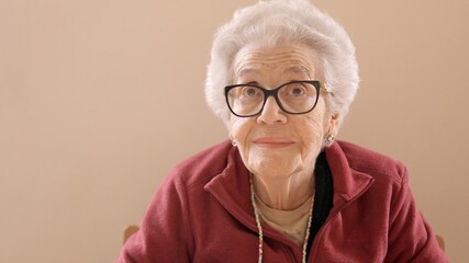 Senior woman with spectacles looking at camera
