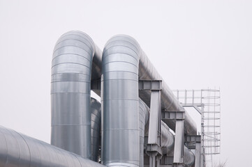 pipelines close-up against a gray sky