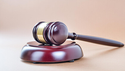 brown gavel on the table on a brown background - obrazy, fototapety, plakaty