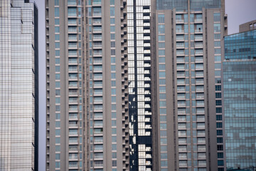 Blue-toned glass windows of the Jakarta skyscrapers