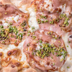 Pizza mortadella and pistachios