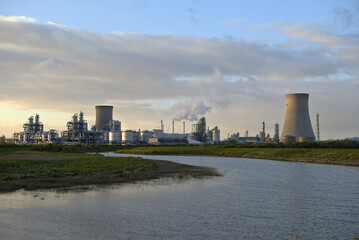 HDR Oil refinery, cooling towers, with smoke.